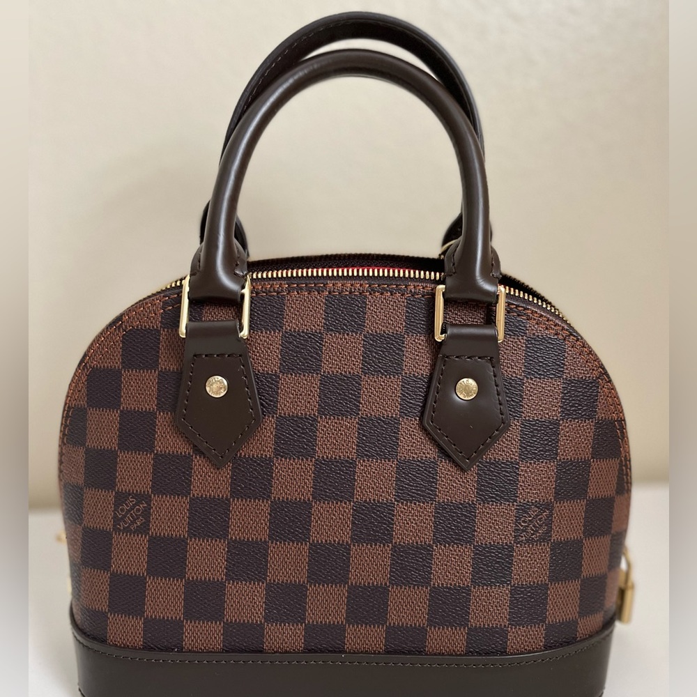 Brown checkered squares satchel handbag with strap top handle